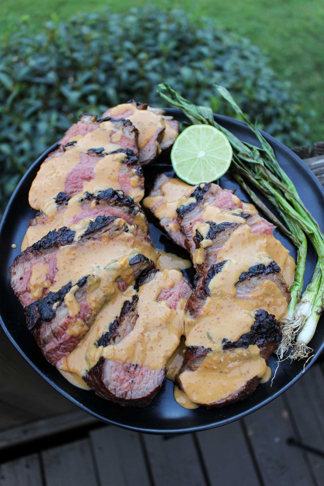 Grilled Steak with Peanut Butter Sauce with the drizzled sauce.