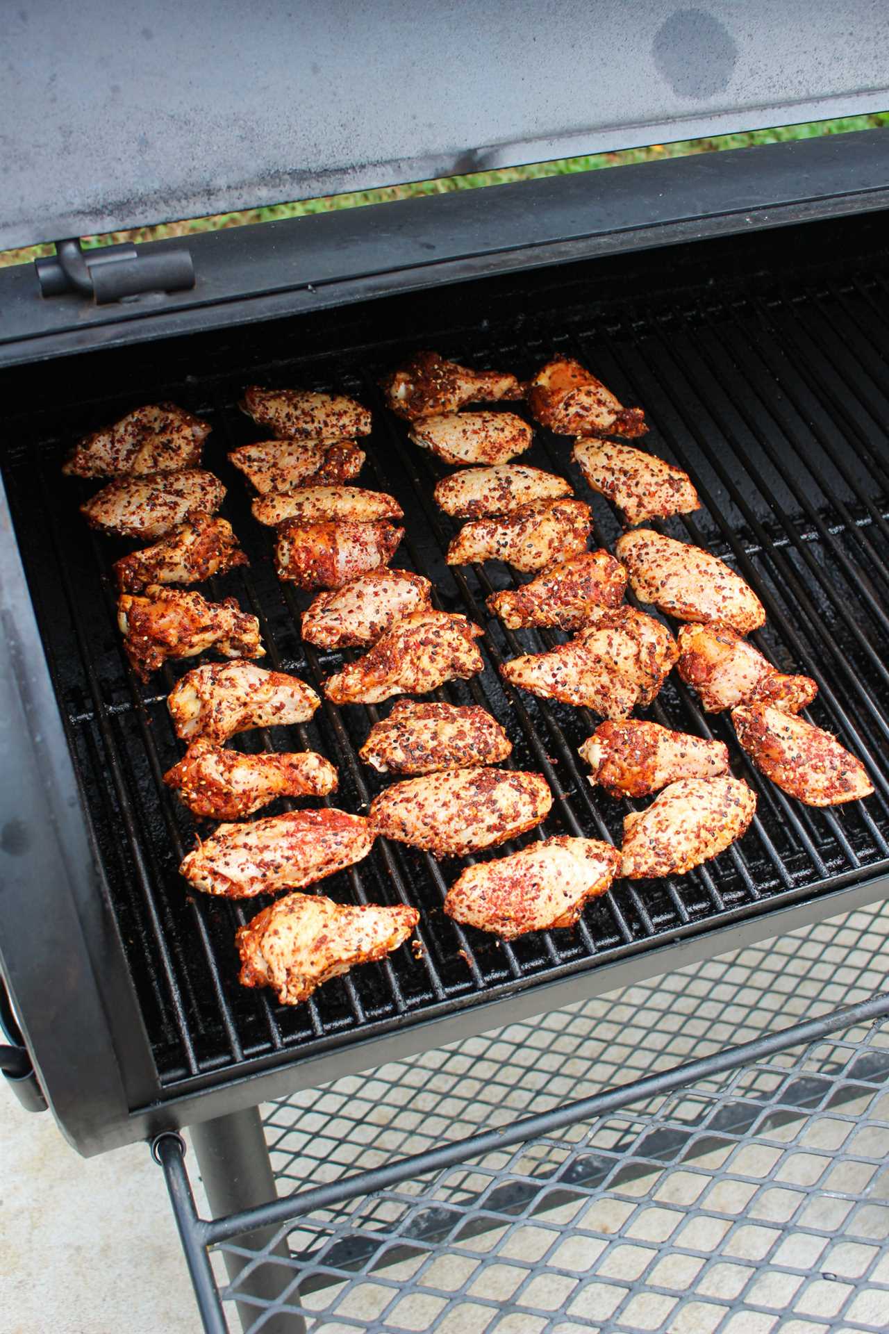 Honey Gochujang BBQ Wings hit the smoker