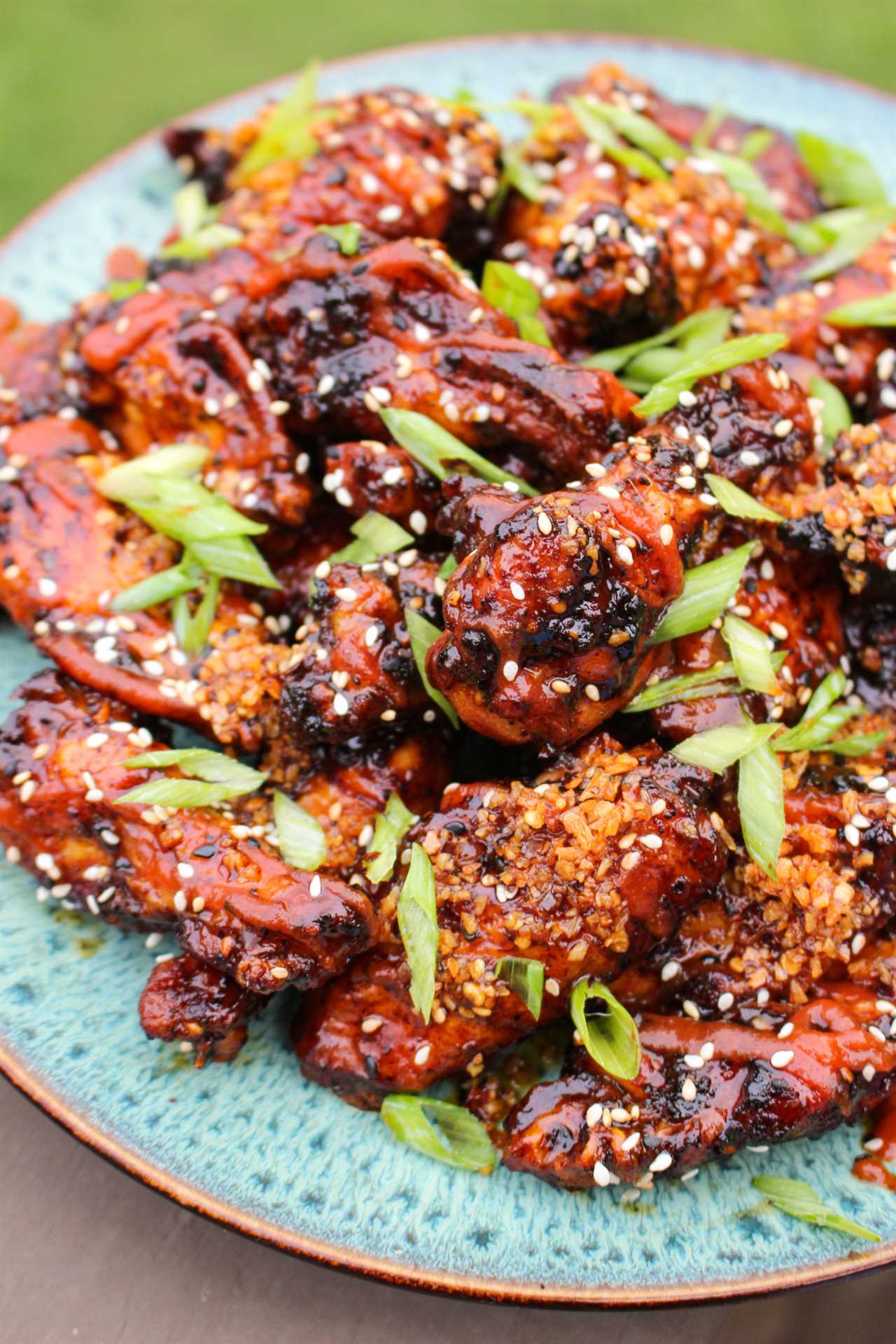 Honey Gochujang BBQ Wings get garnished