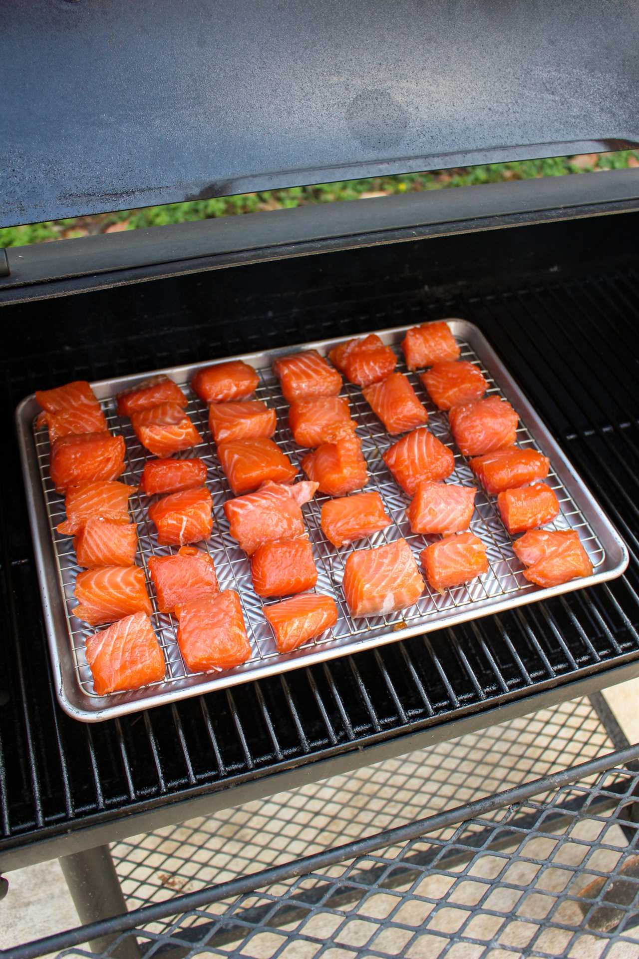 Smoked Salmon Burnt Ends hitting the smoker. 