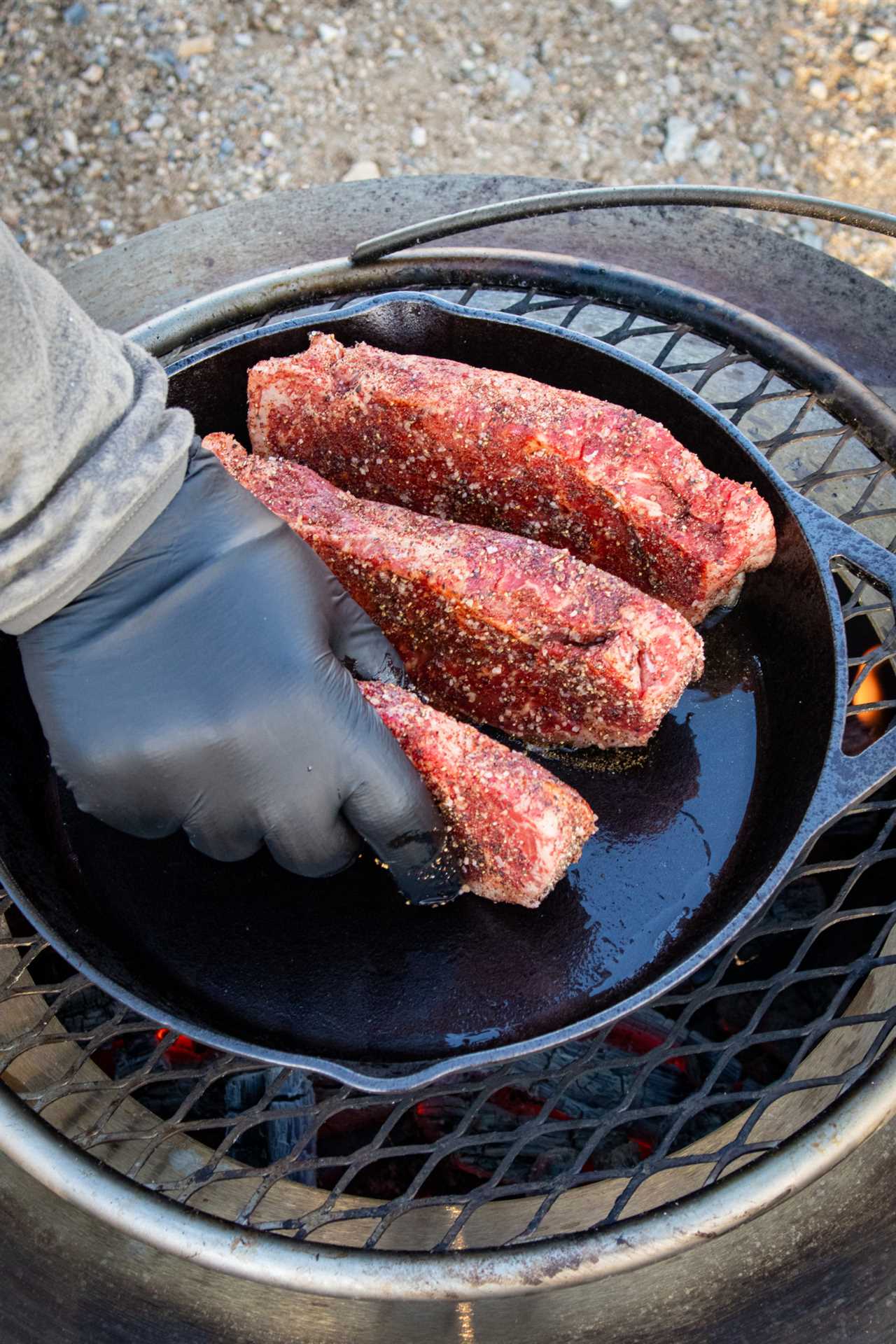 New York Strips with Bourbon Mushrooms hitting the skillet. 