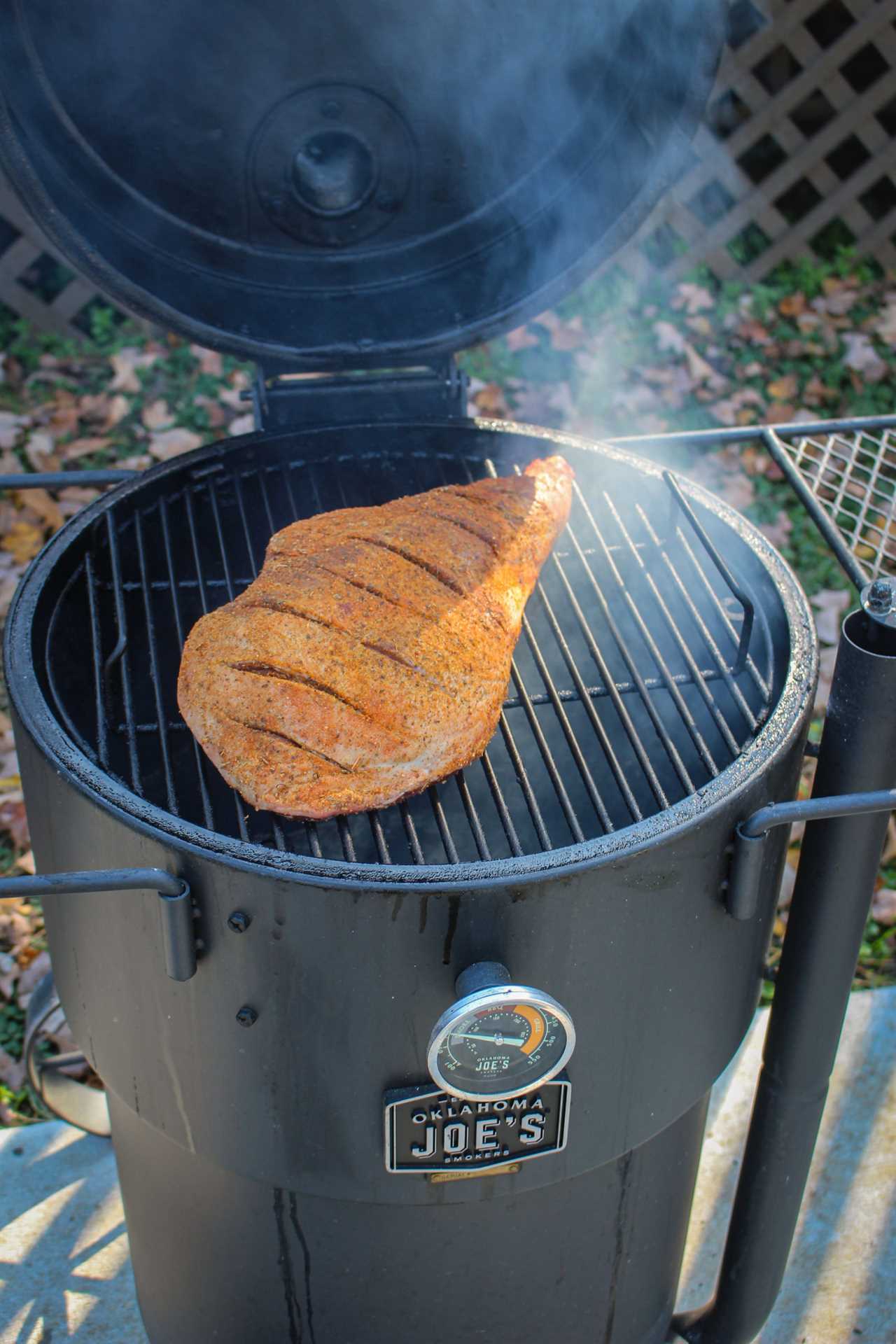 Smoked Leg of Lamb getting placed on the smoker. 