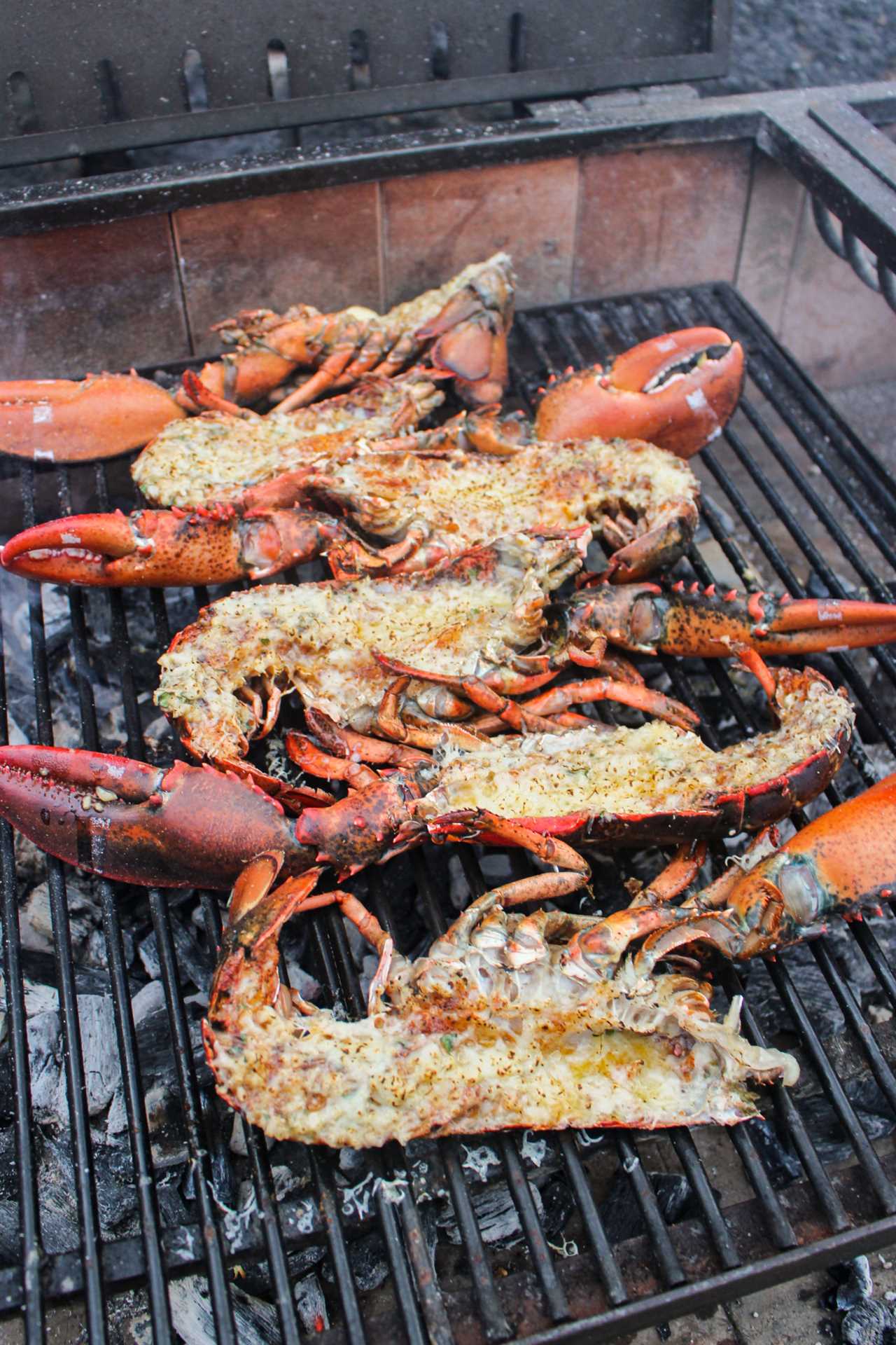 Grilled Garlic Butter Lobster flipped and covered in butter. 