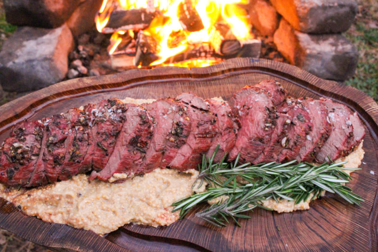 Herb Crusted Bison Tenderloin cut and fanned out to serve.