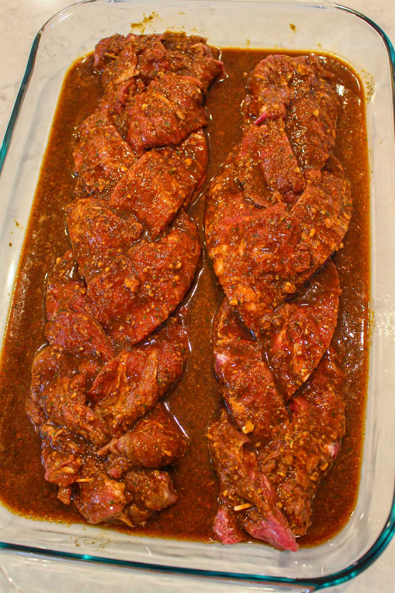 Braided Skirt Steaks in their marinade.