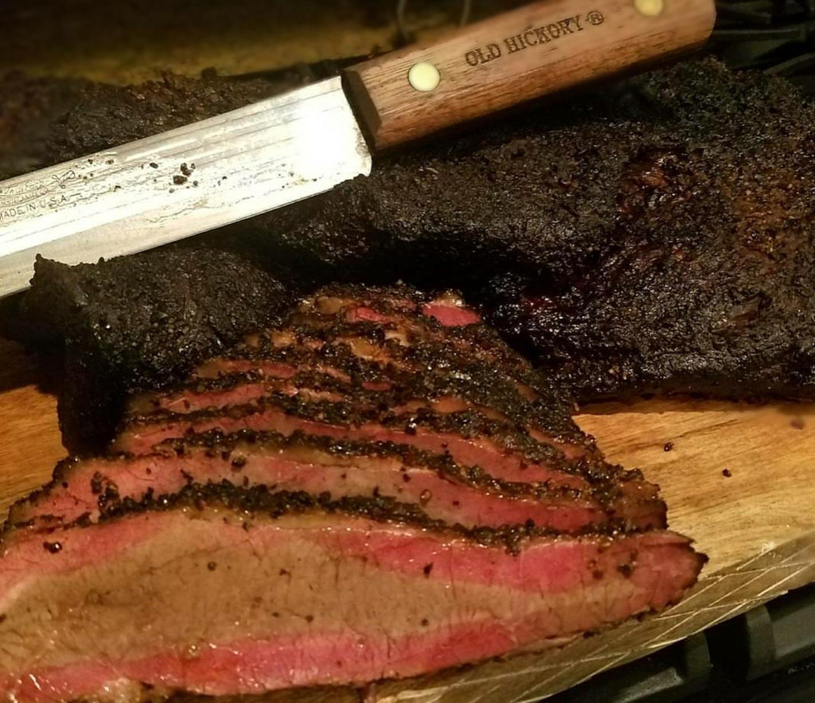 a tri tip sliced on a cutting board