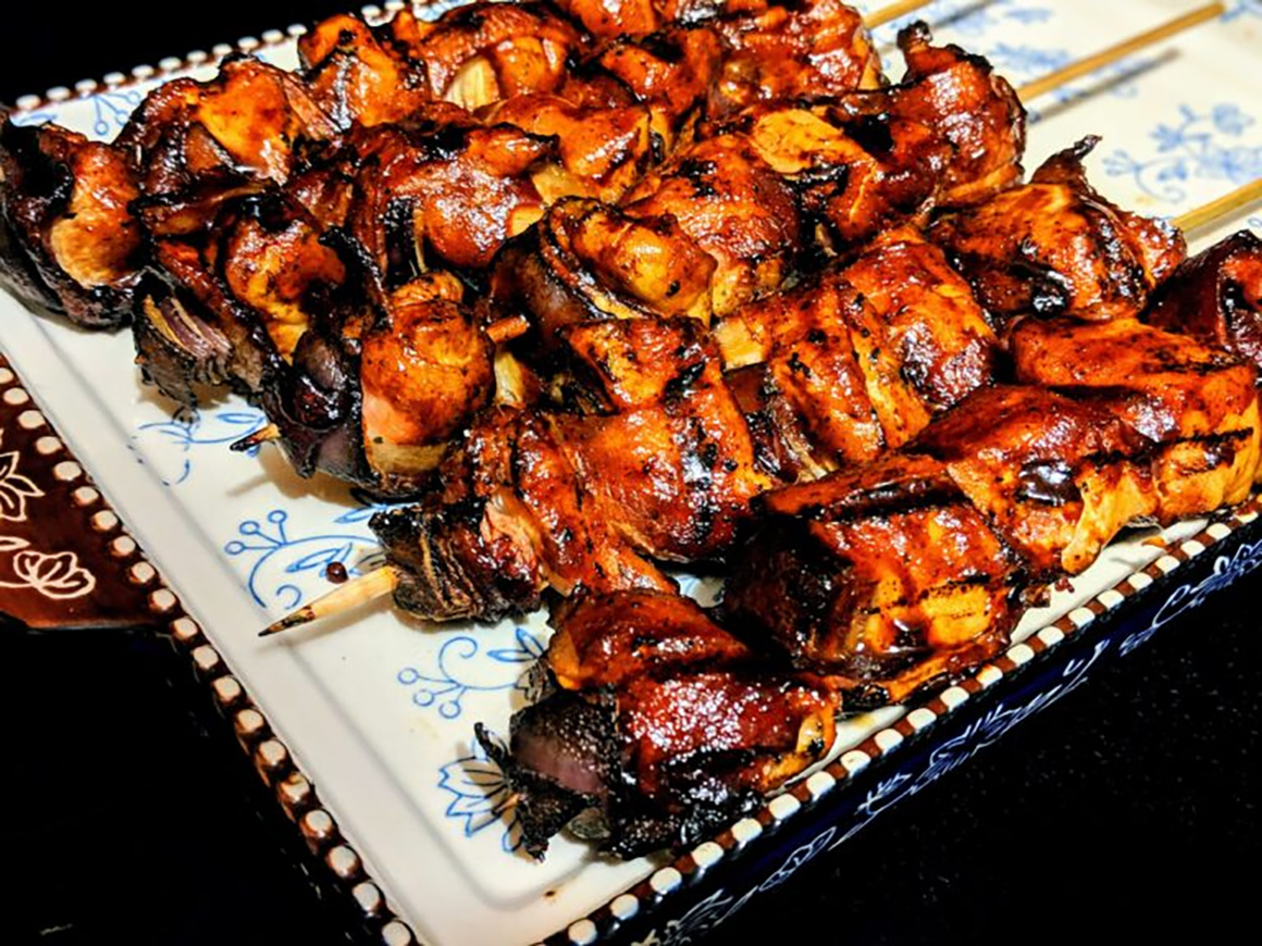 a tray of freshly cooked kebobs