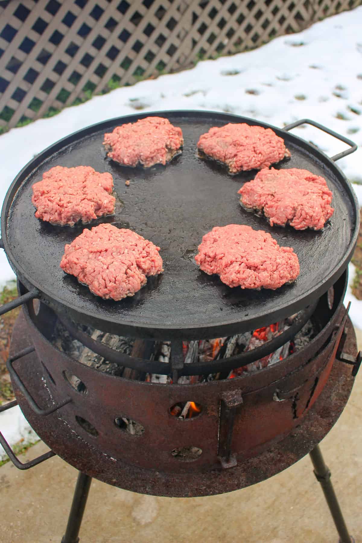 Chopped Texas Patty Melt with the patties hitting the grill.