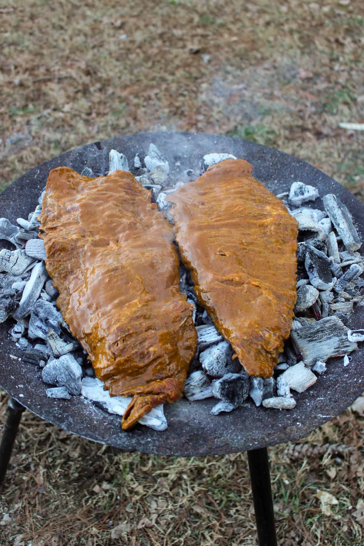 Skirt steak laid on the coals for the perfect topping to our Loaded Steak Fries recipe. 