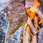 A close up shot of Rotisserie Leg of Lamb.