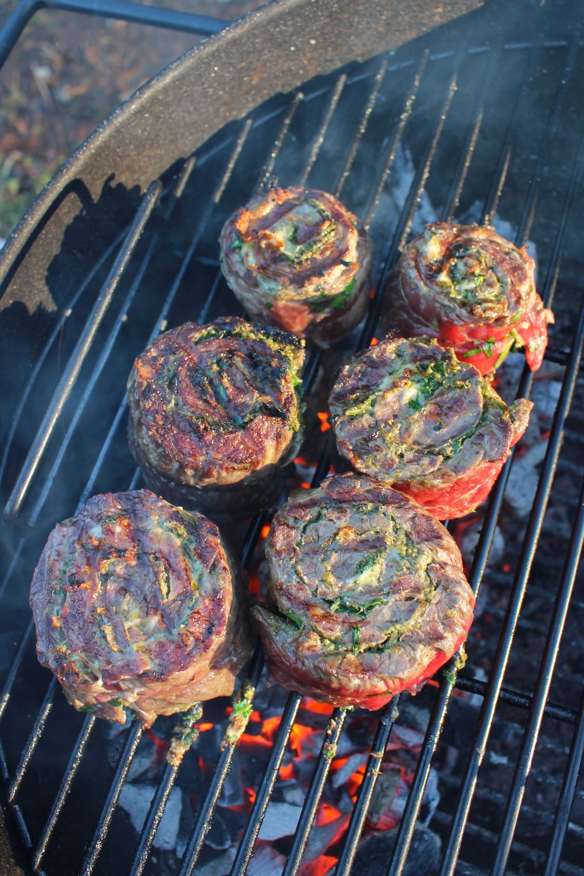 Skirt Steak Pizza Pinwheels after the first flip on the grill.