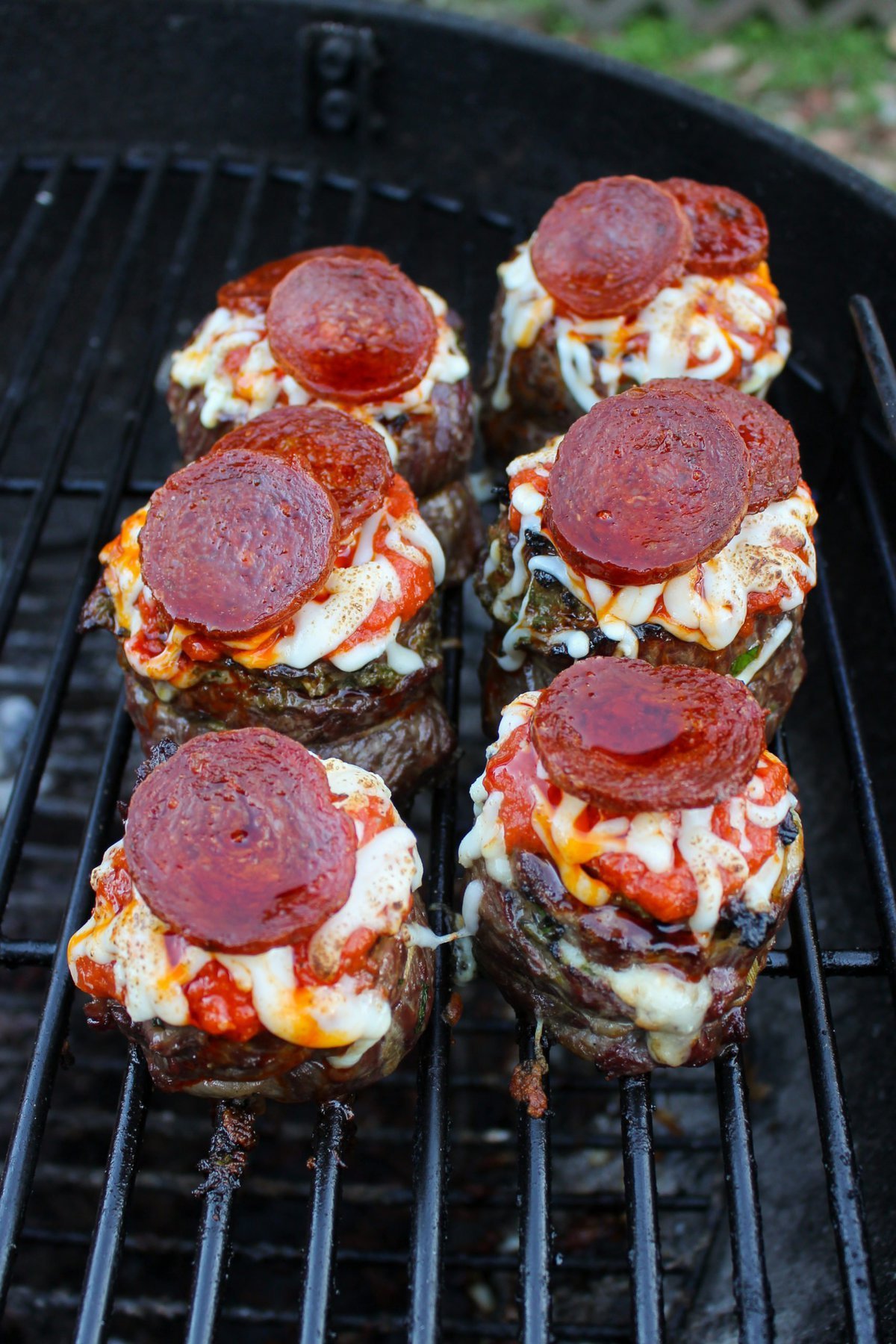 Skirt Steak Pizza Pinwheels about to be pulled of the grill and served.