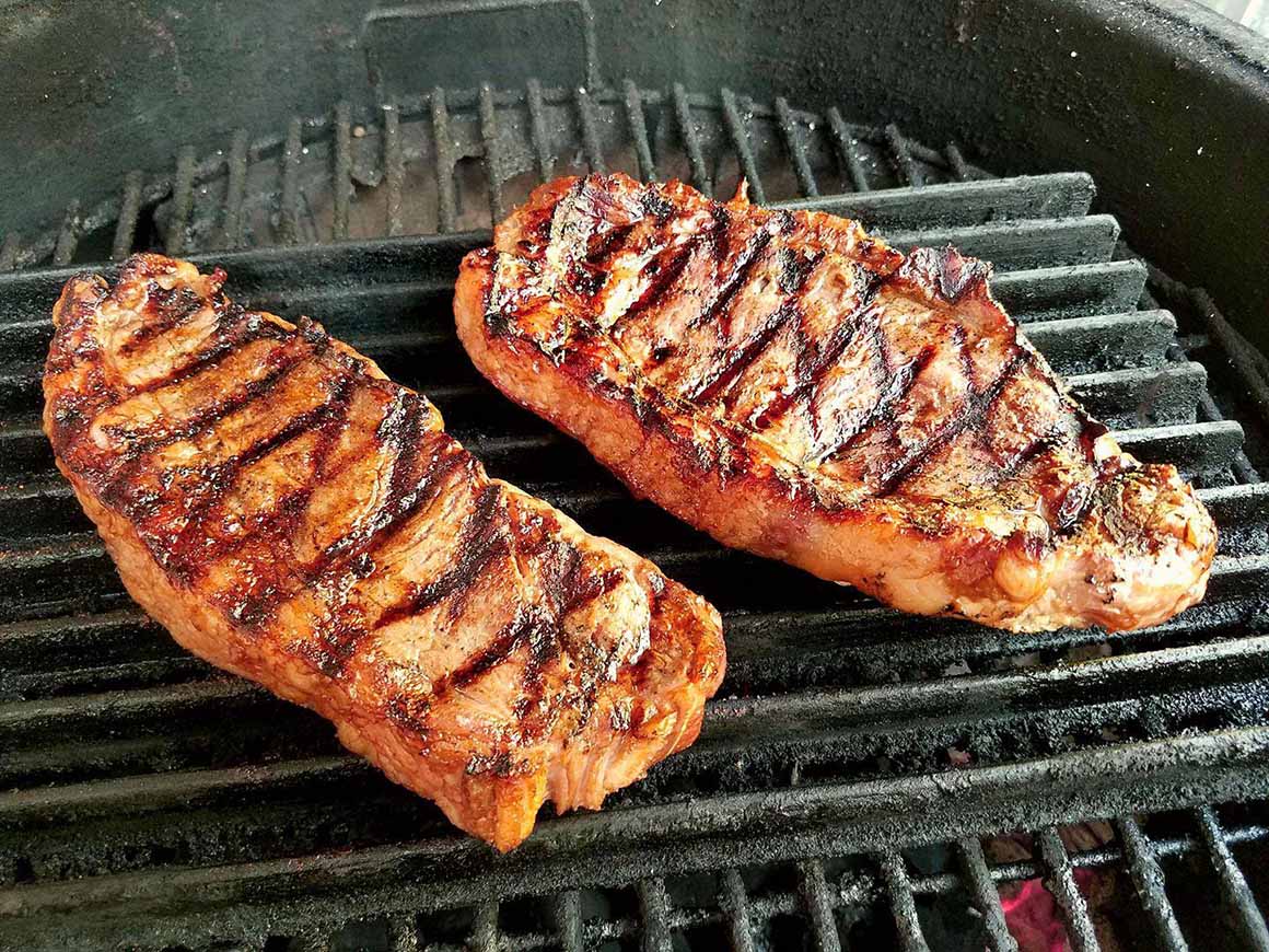 pair steaks grilling