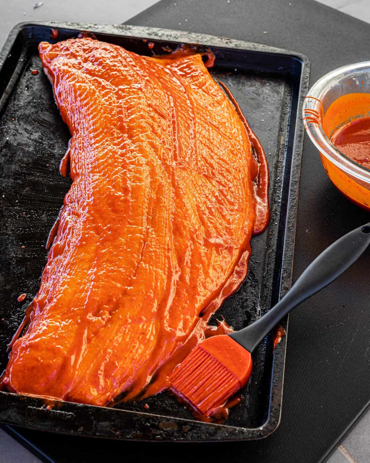 The salmon after seasoning and ready for the fire. 