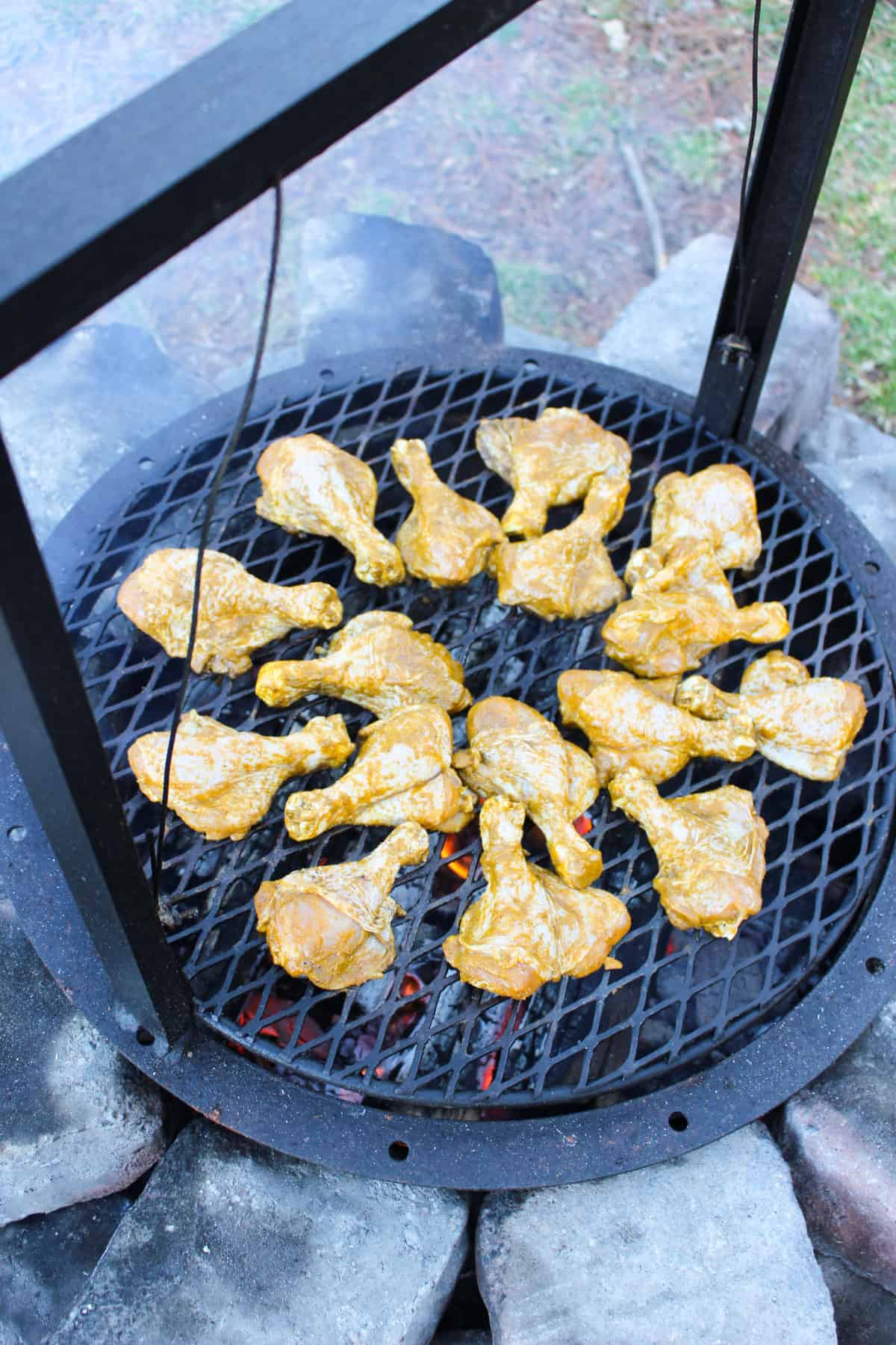 Butterflied Peruvian Chicken Drumsticks with Green Sauce getting started on the grill.