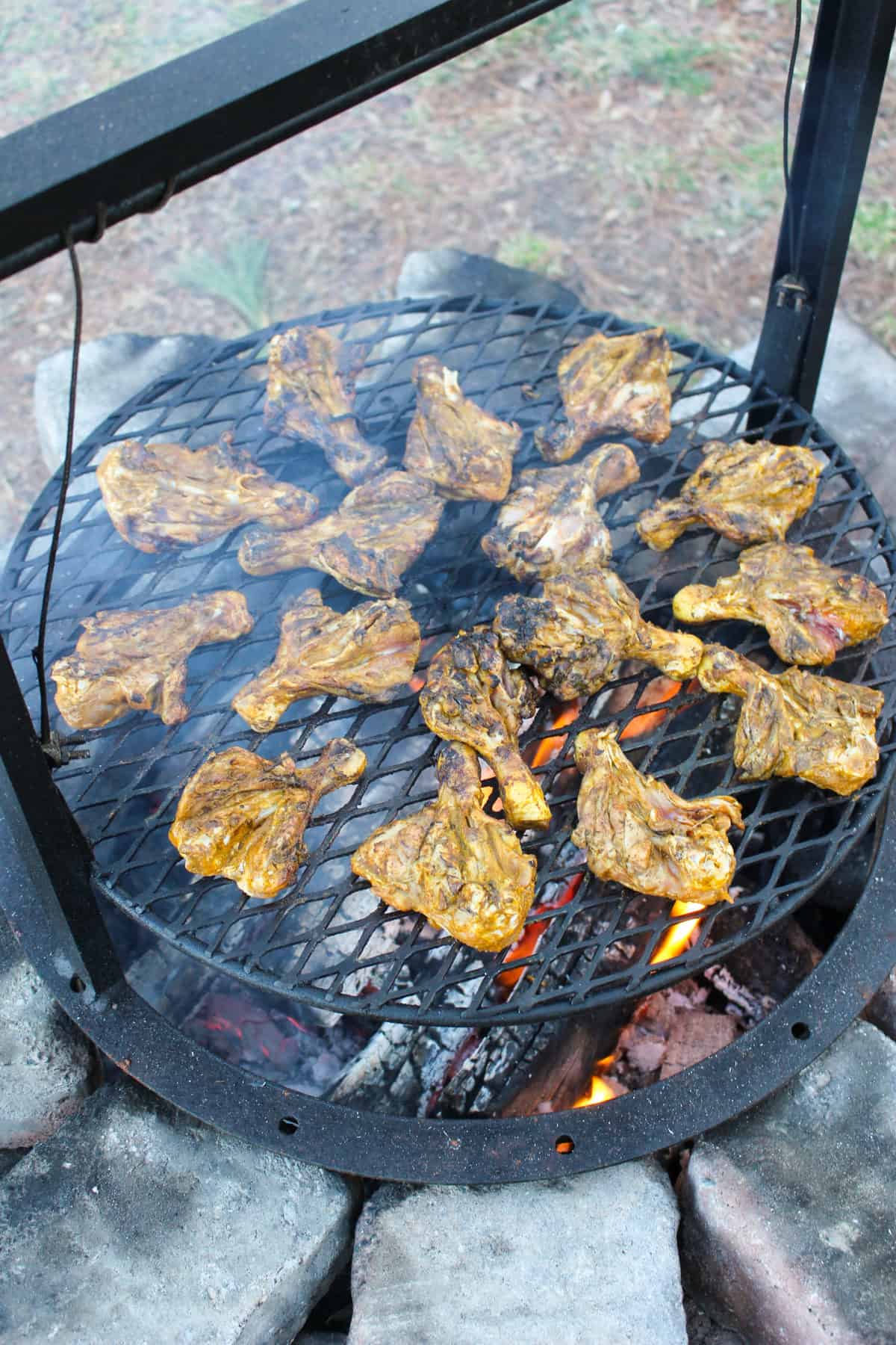 Drumsticks after their first flip on the grill.