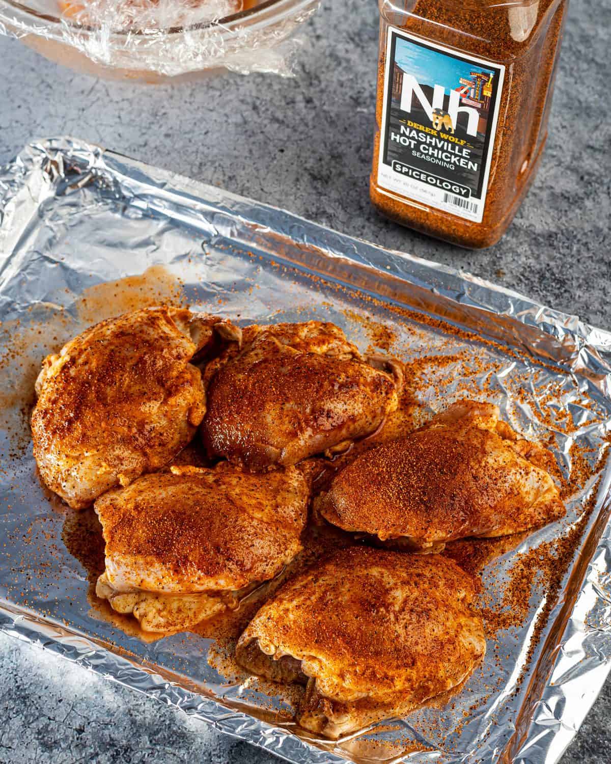 The marinated chicken getting seasoned before hitting the smoker. 