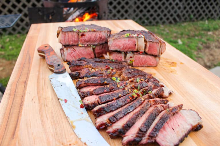 Sliced ribeyes on the platter.