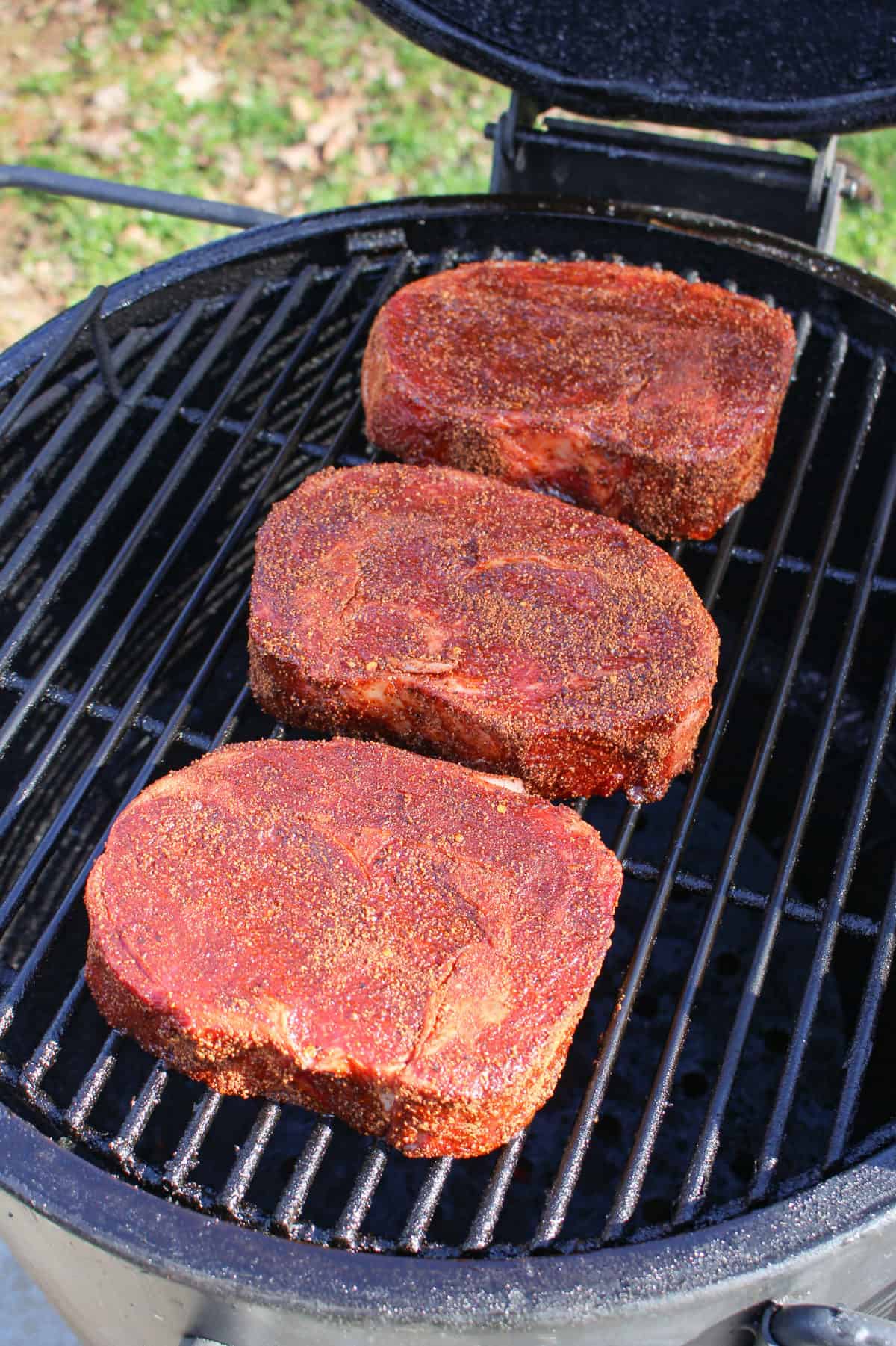 Coffee Crusted Ribeyes on the smoker.