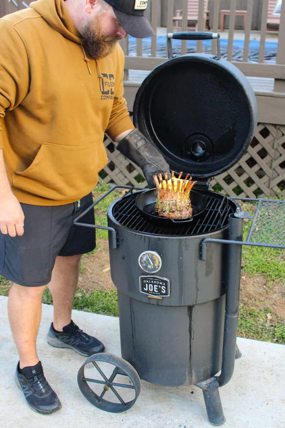 Derek pulling the lamb off the Oklahoma Joe's smoker.