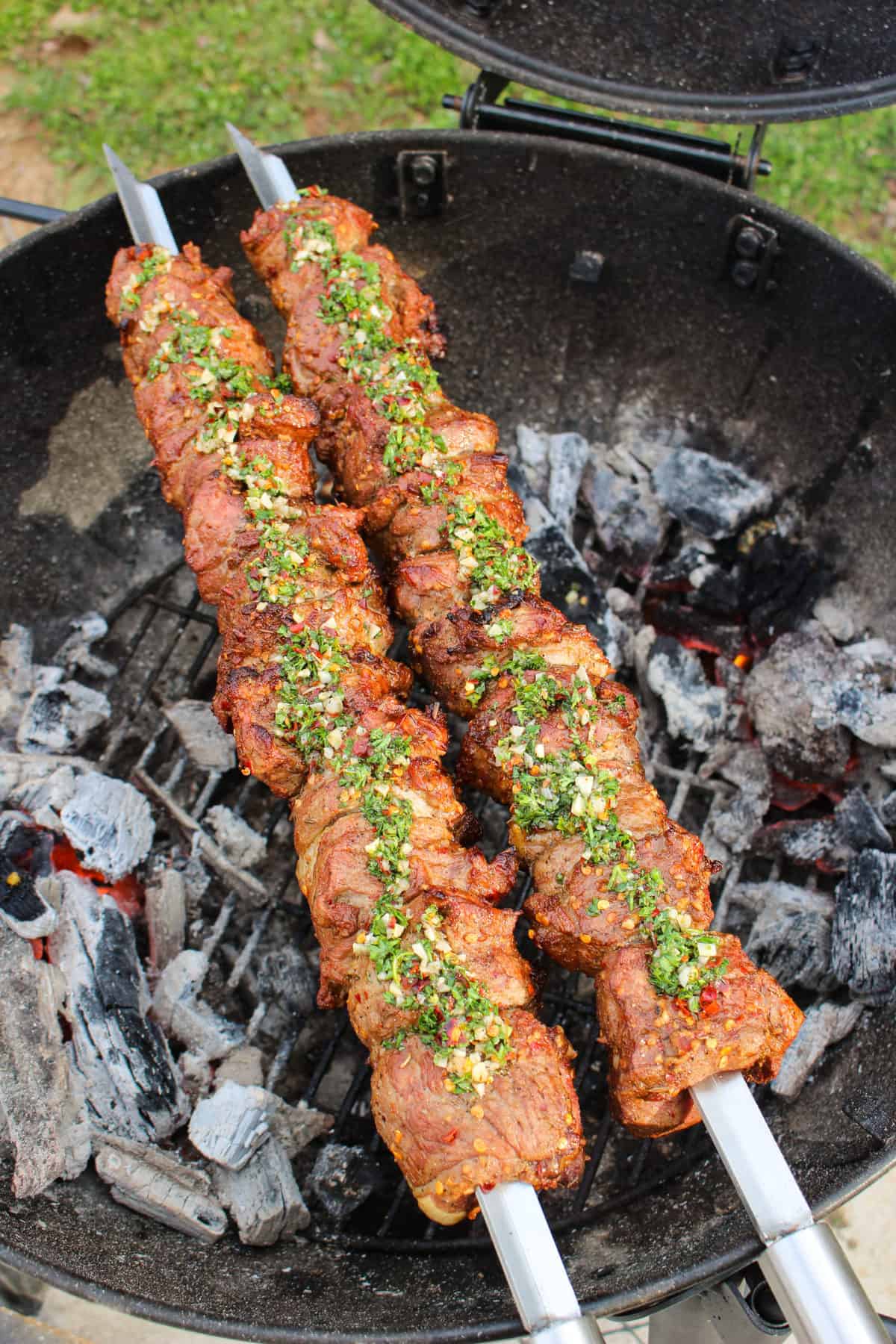 Mint Chimichurri gets spread across the lamb