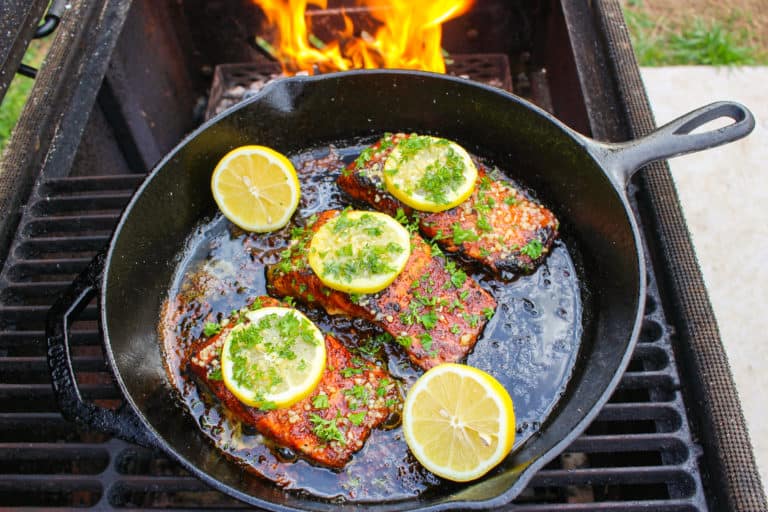 Nashville Hot Cast Iron Salmon sitting on the grill but ready to be served.