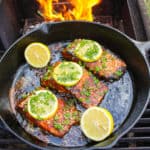 Nashville Hot Cast Iron Salmon sitting on the grill but ready to be served.