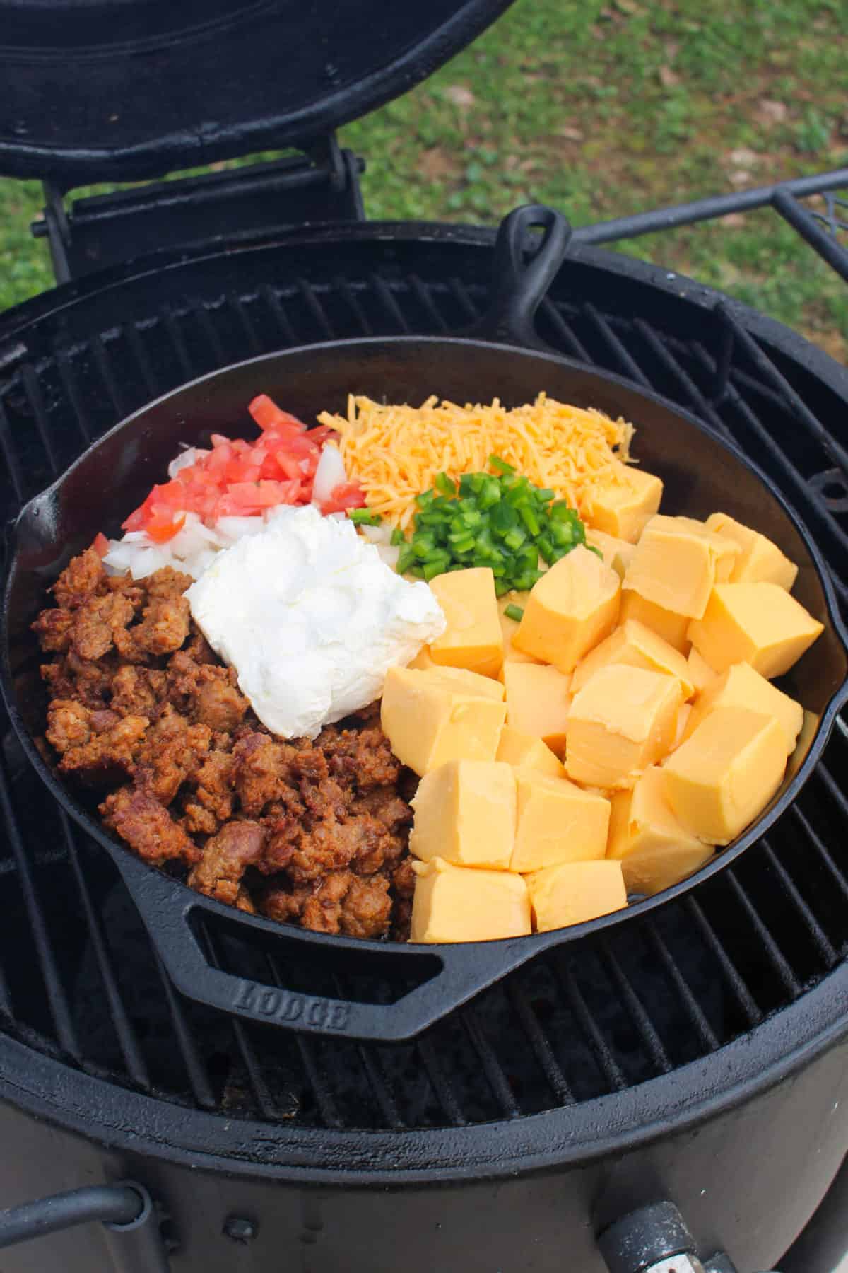 Smoked Chorizo Queso getting started in the skillet on the smoker. 