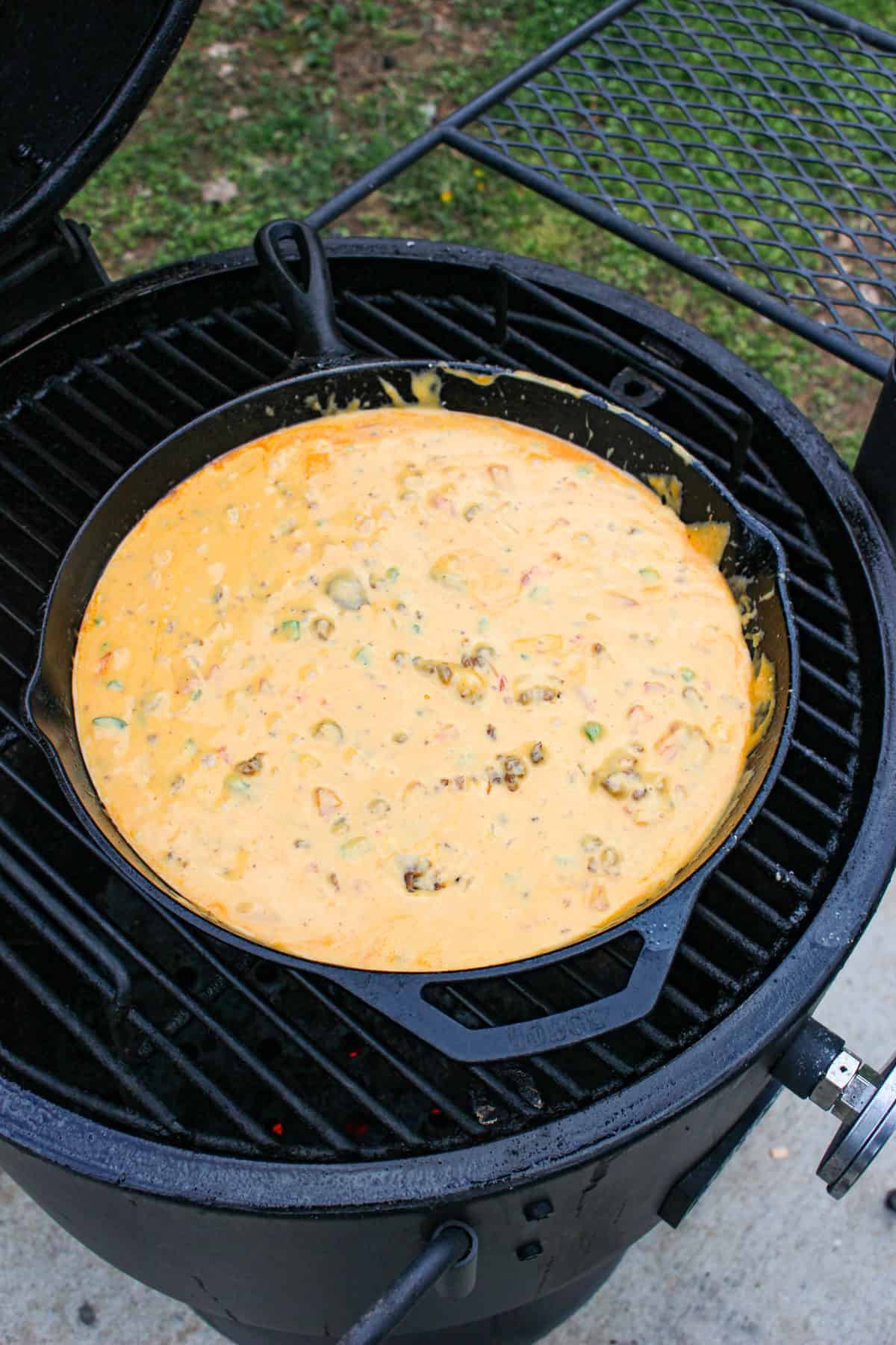 Smoked Chorizo Queso with all ingredients melted together and ready to be garnished.