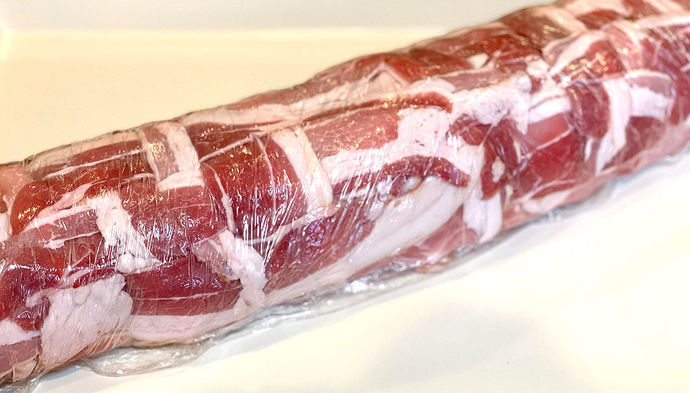 charcuterie stuffed pork loin wrapped