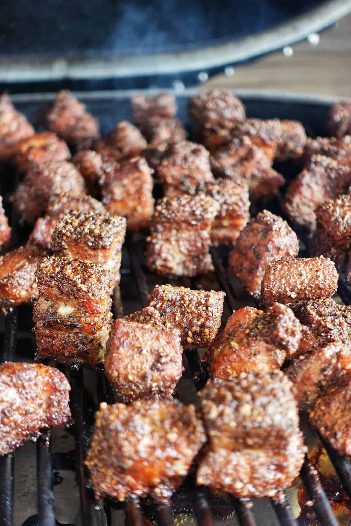 Burnt ends sitting on the smoker. 