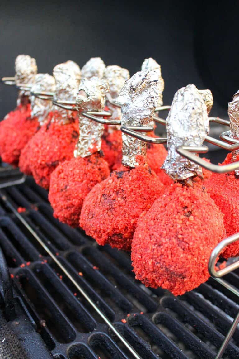 Flamin' Hot Chicken Lollipops after they've been covered in Cheetos.