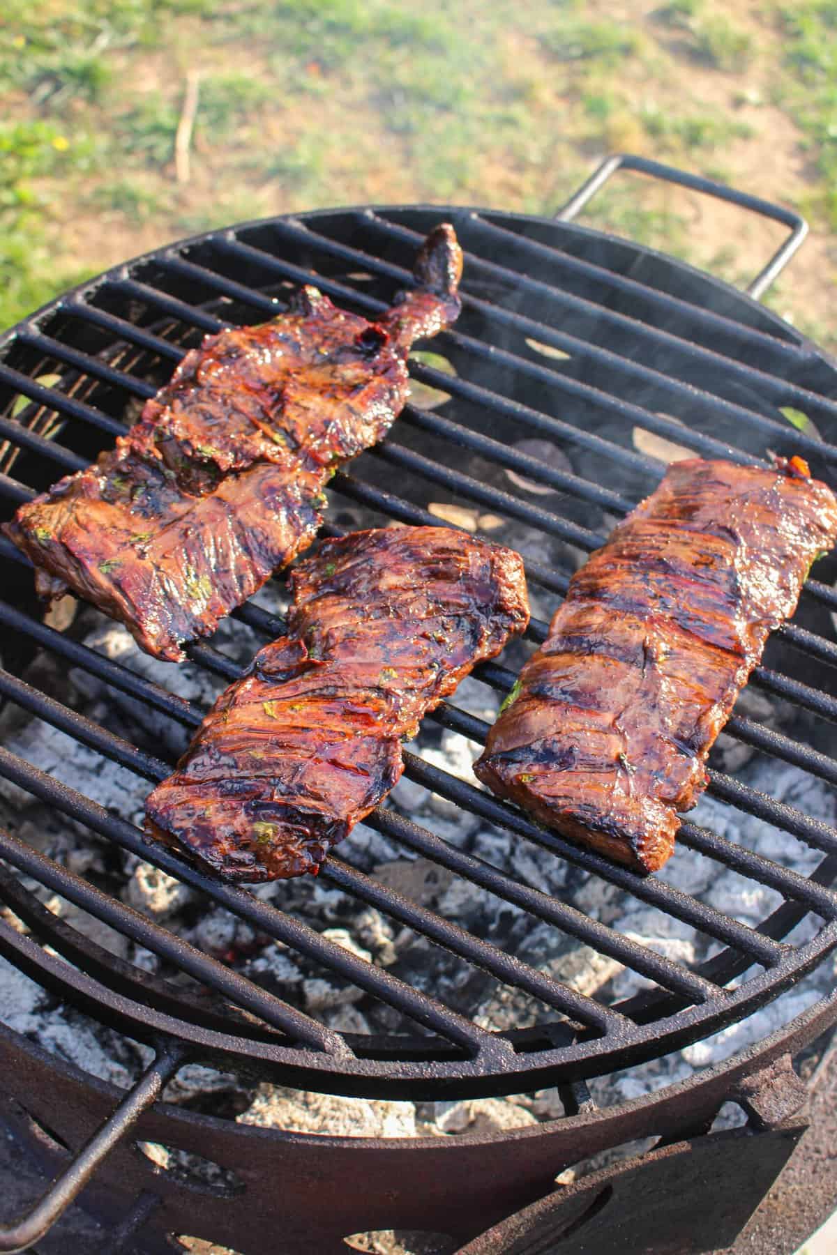 fully cooked steak on the grill from above