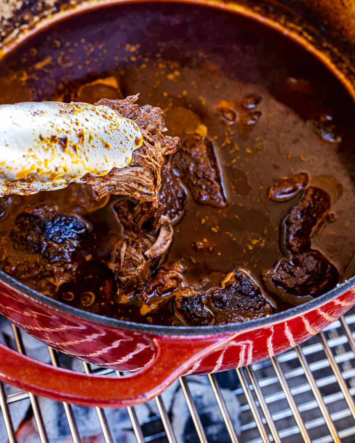 Birria starting to fall apart for Smoked Birria Burgers.