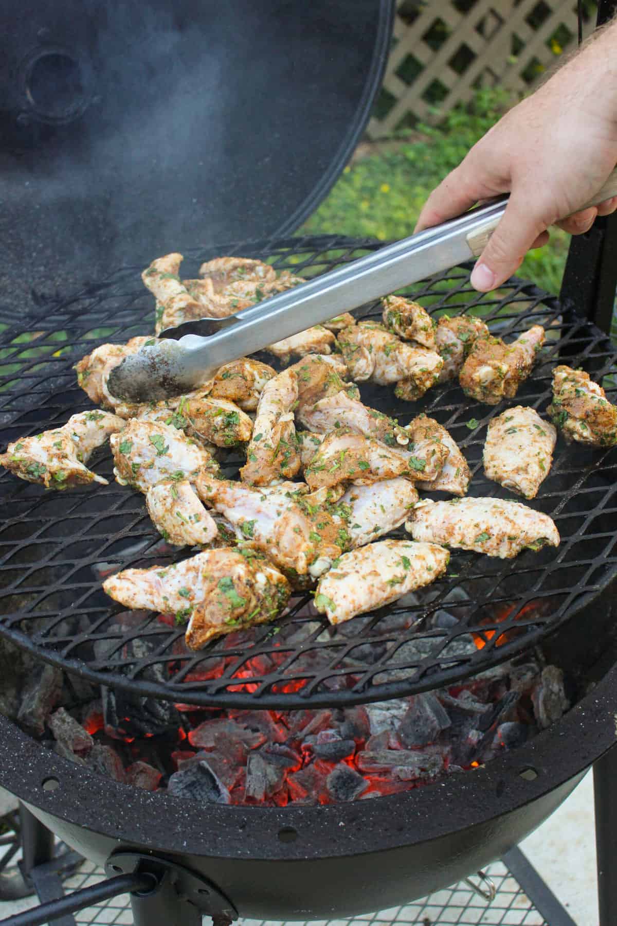 closeup of chicken wings being cooked on the grill