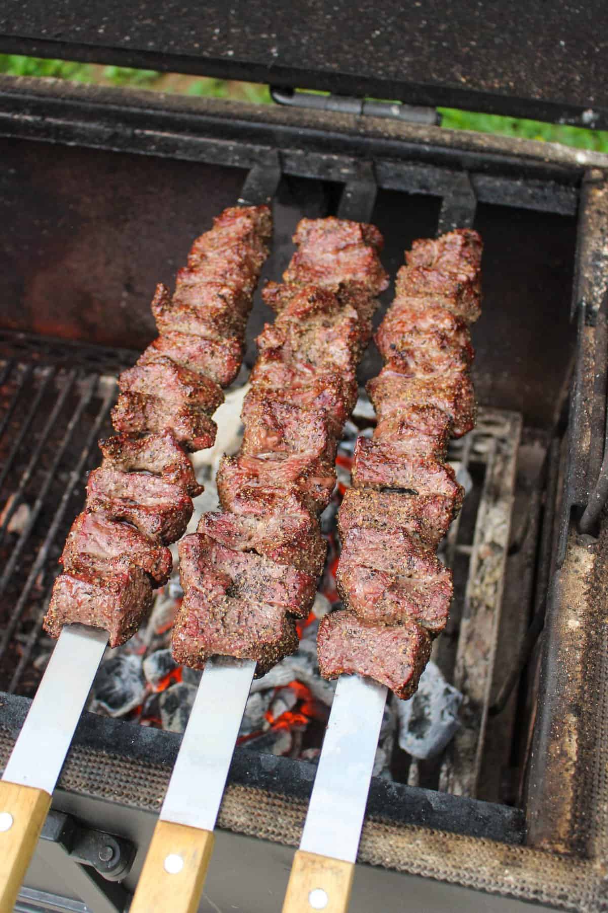 grilled steak skewers on the grill