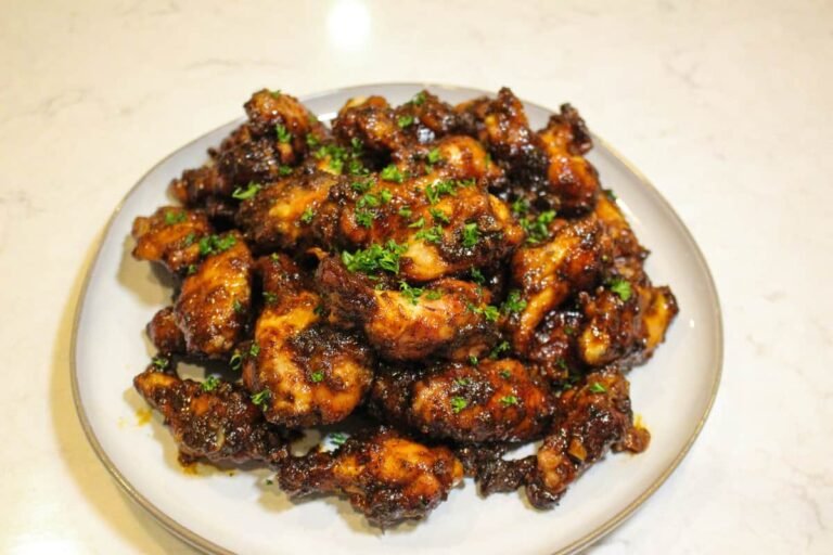 overhead of a plate of honey chipotle garlic chicken wings