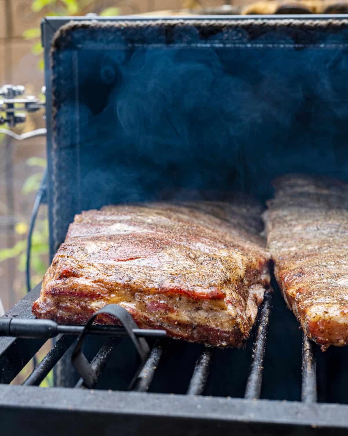 Cherry Cola Spare Ribs getting slid into the smoker.