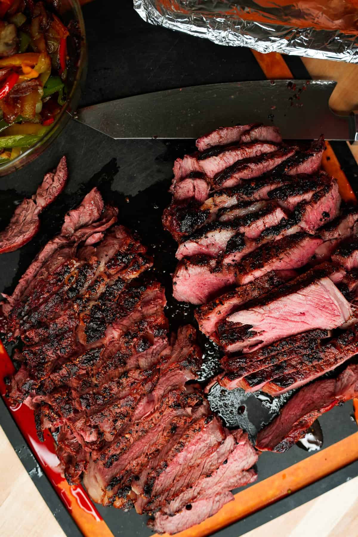 The steak sliced up and ready to be put on the cheesesteak.